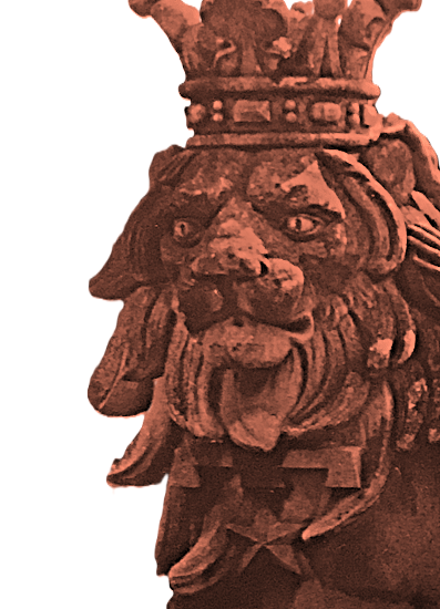 photo of a statue of a lion, carved in stone, wearing a coronet.